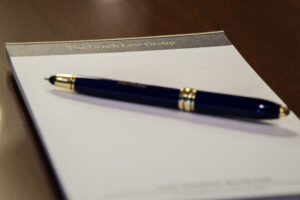 The Lynch Law Group notepad and pen