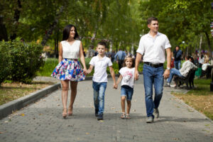 family walking down street