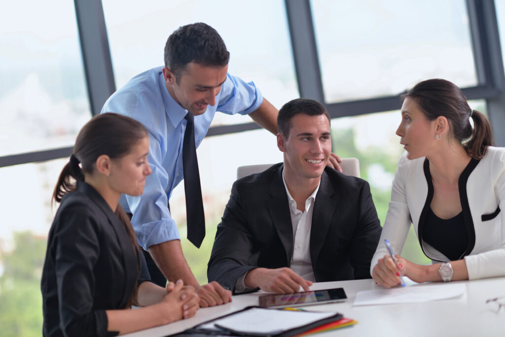 An estate planning team of professionals meet with client to discuss goals.