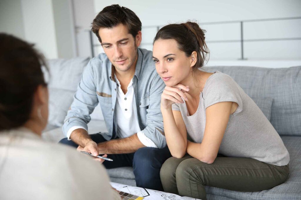 married couple in meeting with attorney
