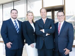 The Lynch Law Group leadership team includes Attorneys Dan Lynch, Charles Hadad, Krista Kochosky