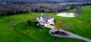 home with gated yard and pond