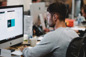 man in office on computer