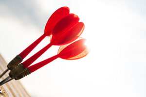 darts on bullseye of target