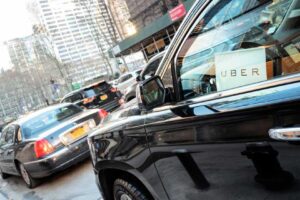 a black Uber car in traffic