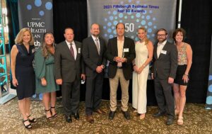 The Lynch Law Group attorneys pose with award at 2021 Fast 50 Awards