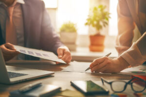 business owner signing documents to dissolve business